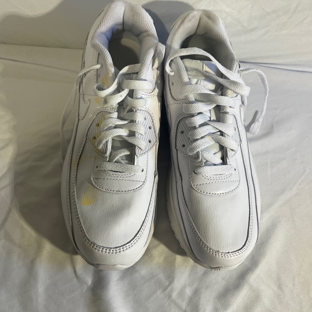 Nike Air Max 90 sneakers, commonly styled as the "Triple White" version.